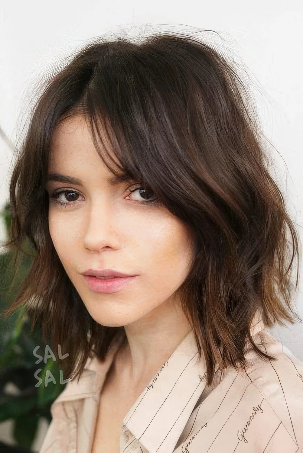 Dark brown layered lob with shaggy layers.