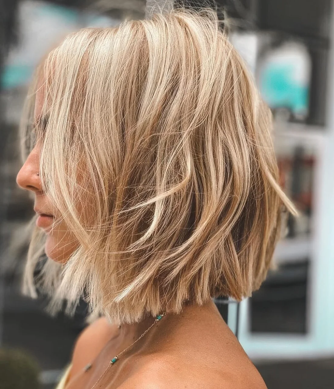Photo showing undercut layered bob hairstyle, with the hairstyle clearly visible.