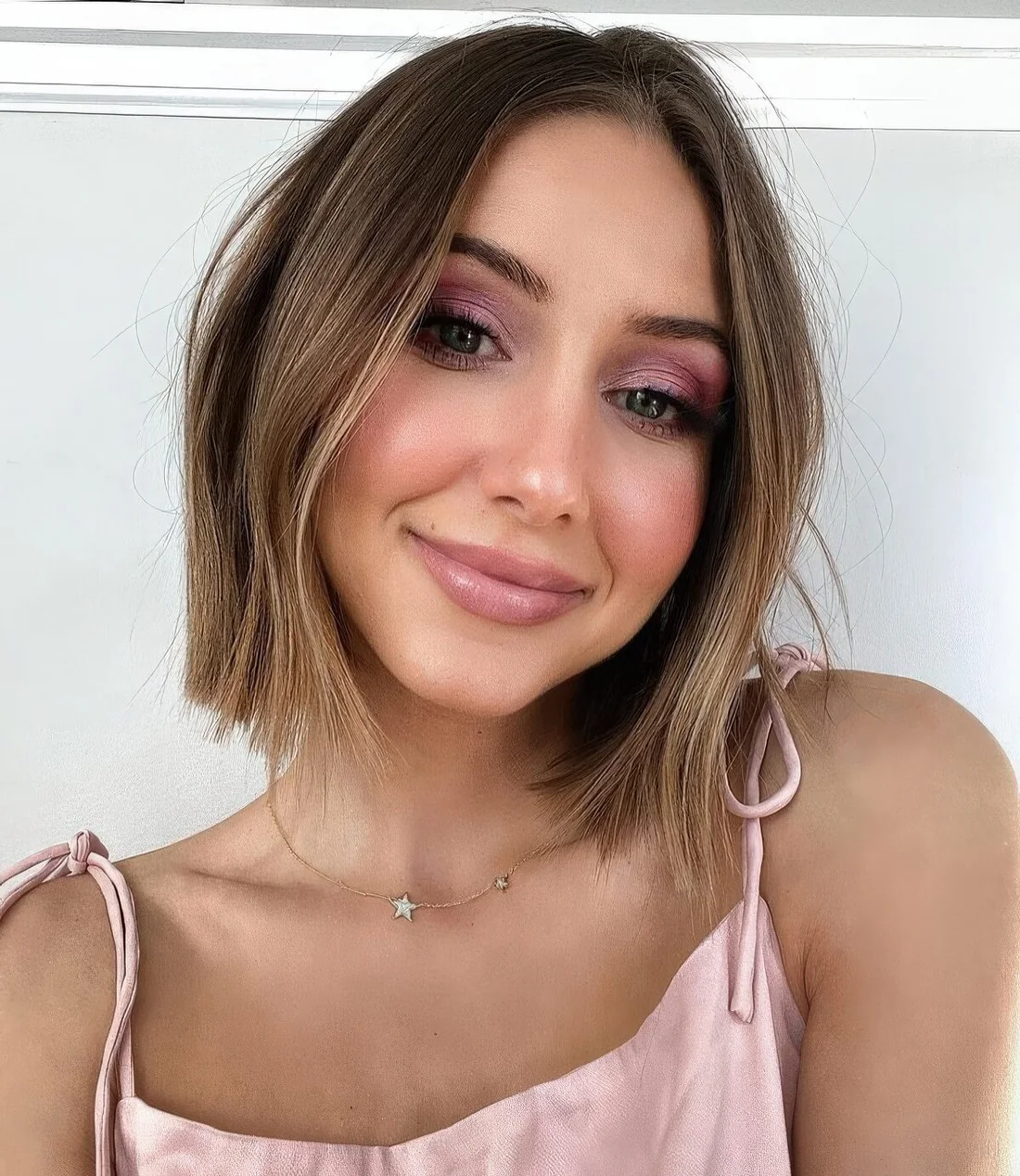 Layered bob with wispy layers to add shape and volume to fine hair, some balayage for a brighter look.