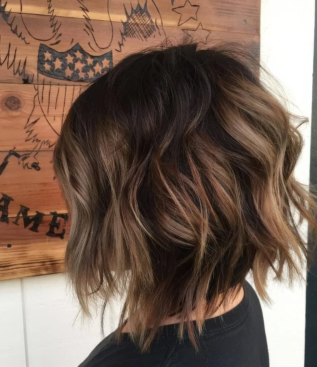 Razored layered bob with a darker root and caramel balayage.