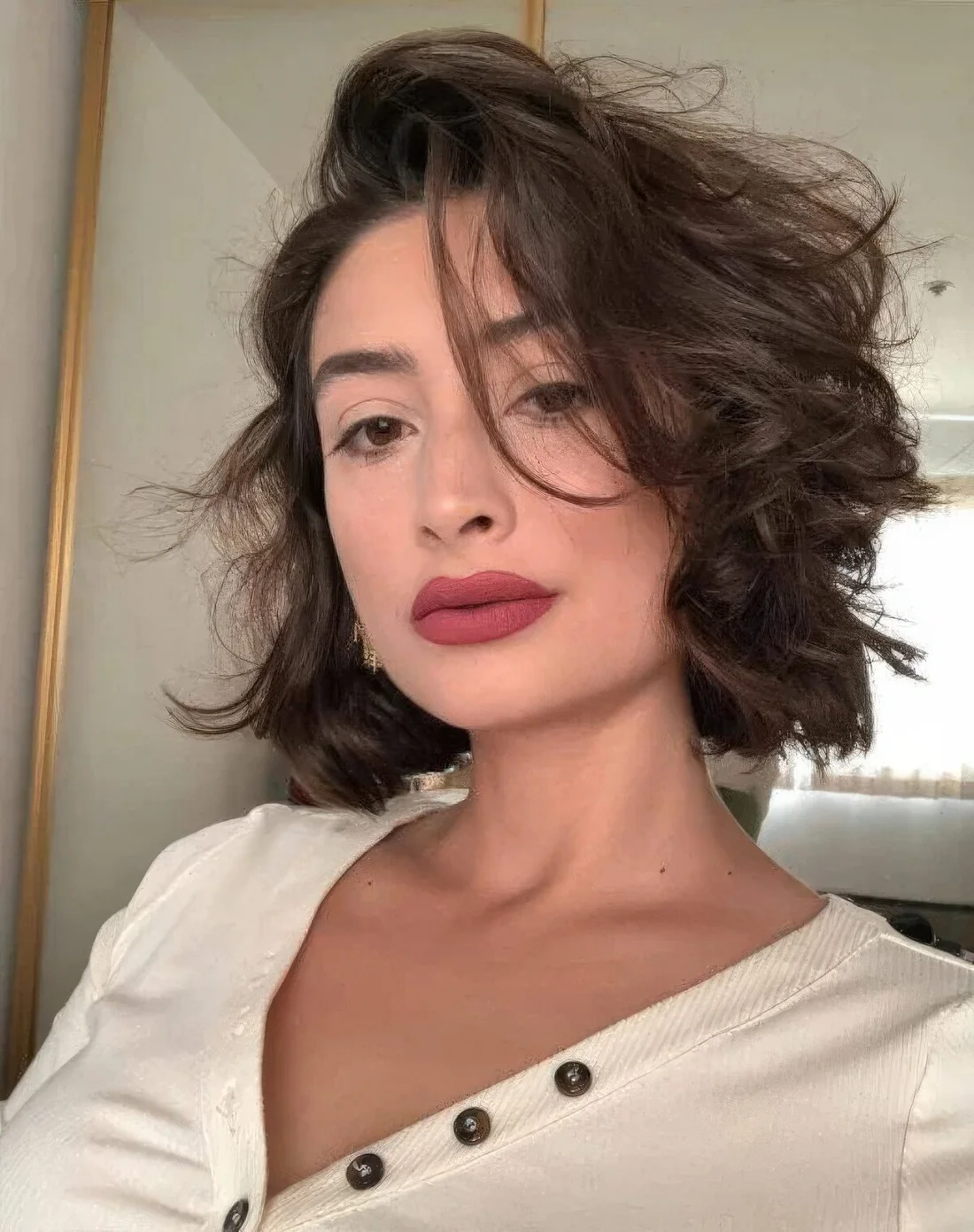Photo showing short bob on naturally curly hair, with the hairstyle clearly visible.