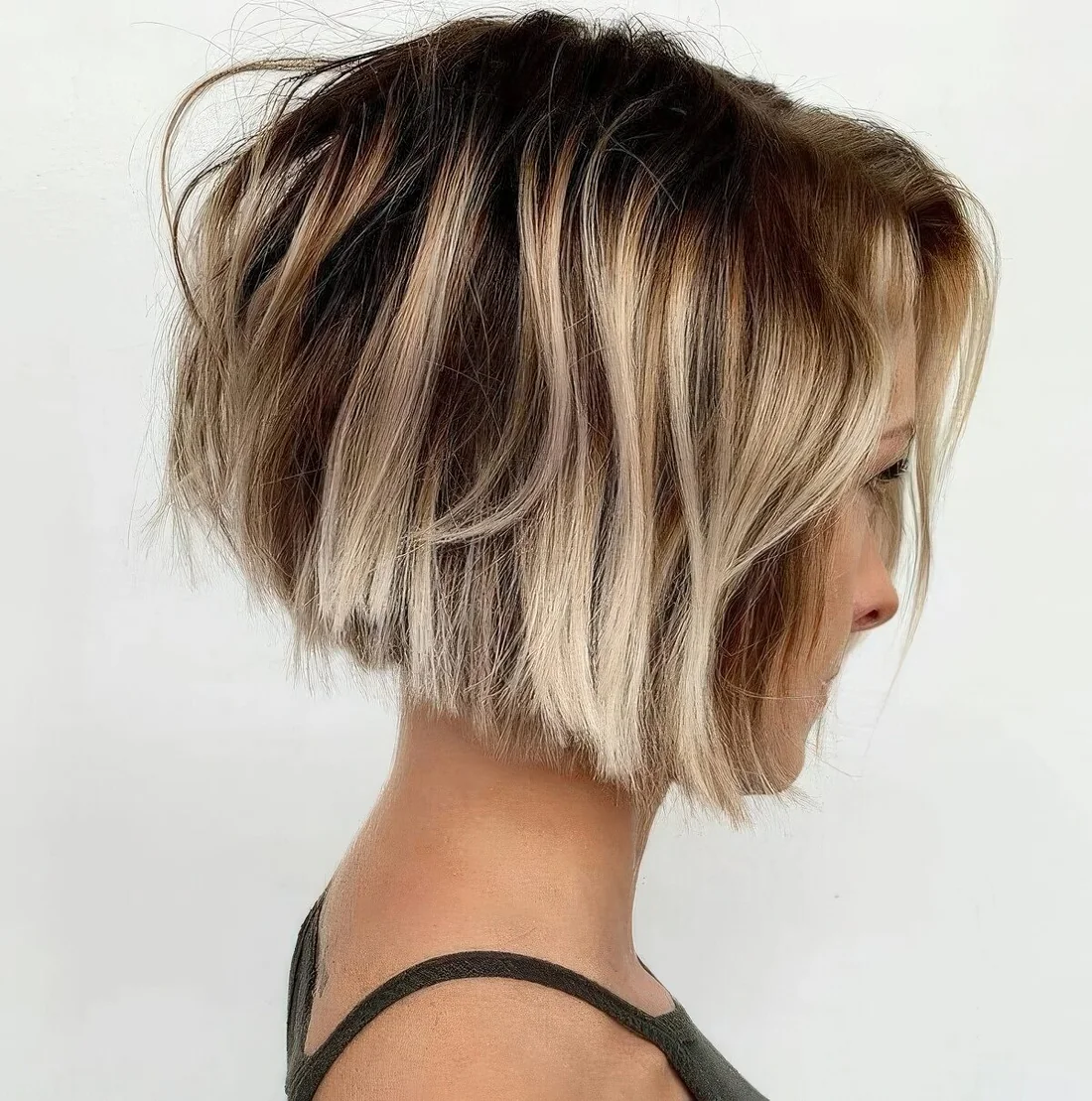 Angled layered bob with subtle graduation and razored layers.