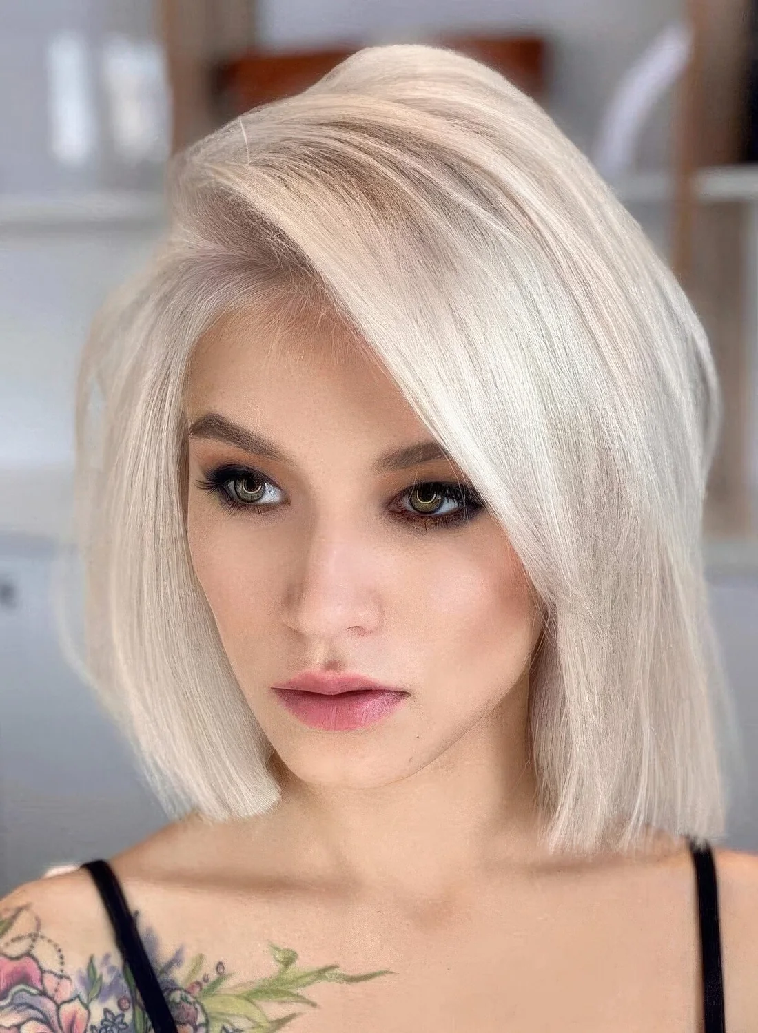 This short layered bob with bangs, where the fringe.