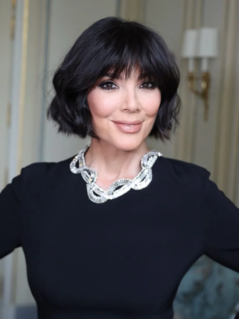 chin straight black bob with curtain fringe shown as a layered bob with curtain bangs idea