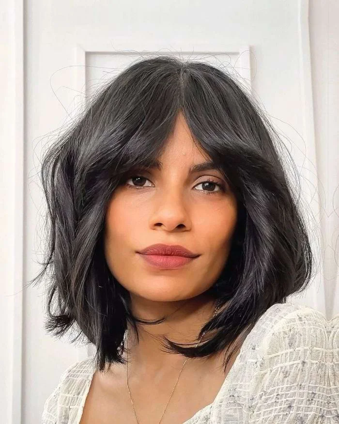 chin straight chestnut bob with curtain fringe shown as a layered bob with curtain bangs idea, featuring light layering