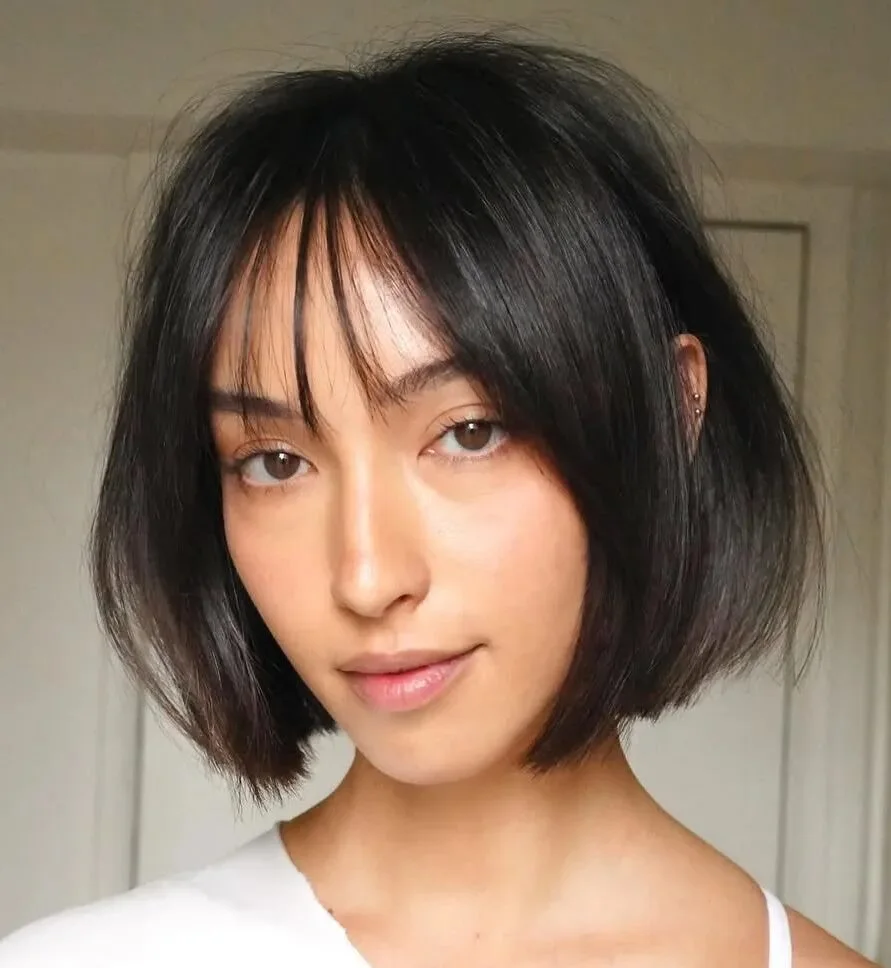 chin straight chestnut bob with curtain fringe shown as a layered bob with curtain bangs idea, featuring center part