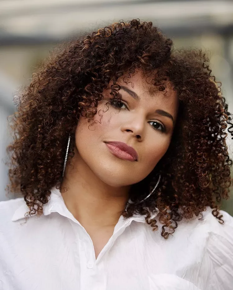 shoulder curly brunette bob with curtain fringe shown as a layered bob with curtain bangs idea