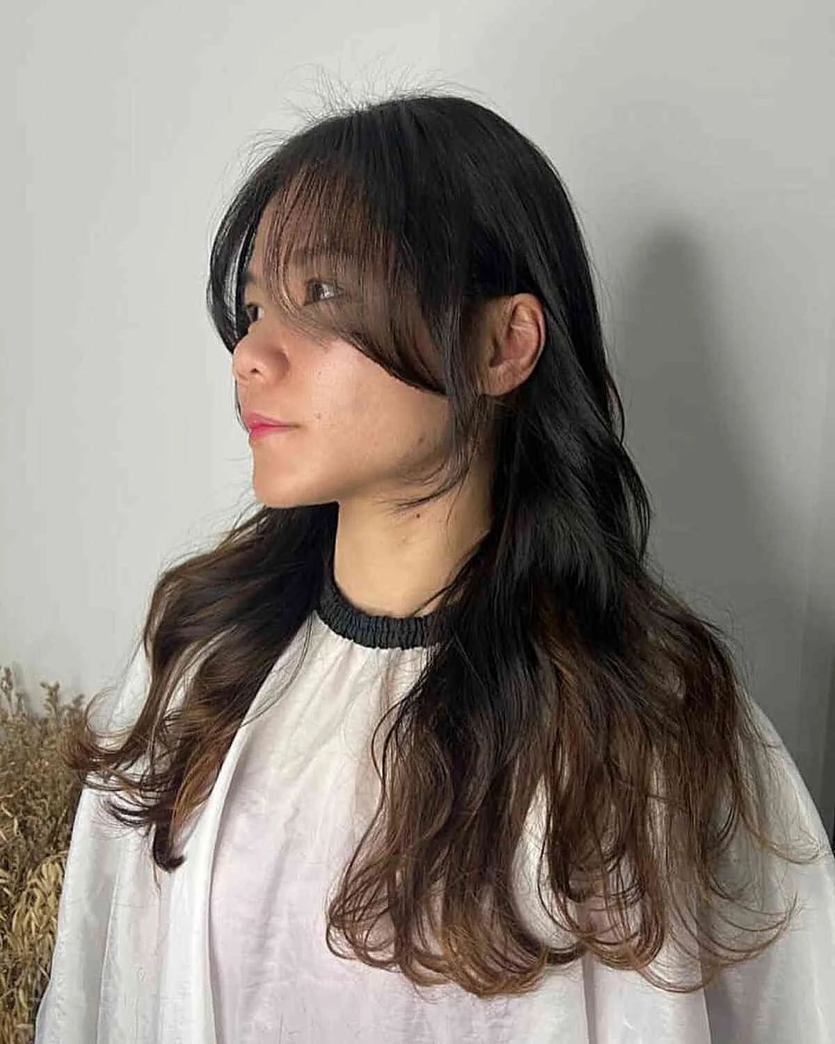 chest wavy chestnut layers with curtain fringe shown as a layered hair with bangs idea