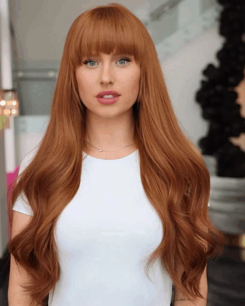 chest straight copper color with blunt fringe shown as a layered hair with bangs idea
