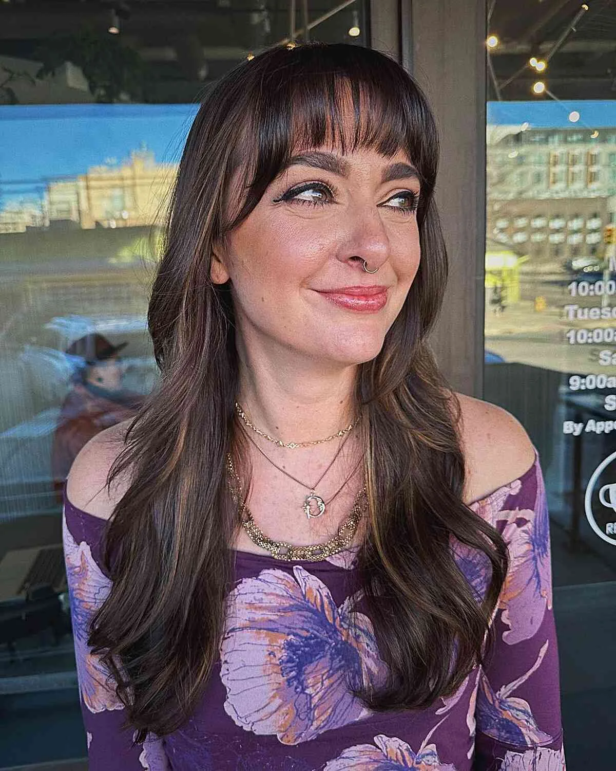 chest wavy chestnut layers with blunt fringe shown as a layered hair with bangs idea