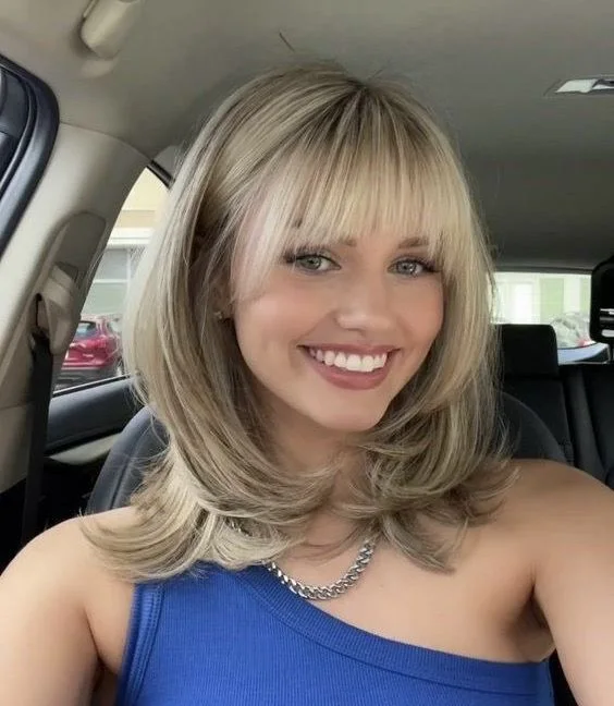 medium straight blonde layers shown as a layered hair with bangs idea