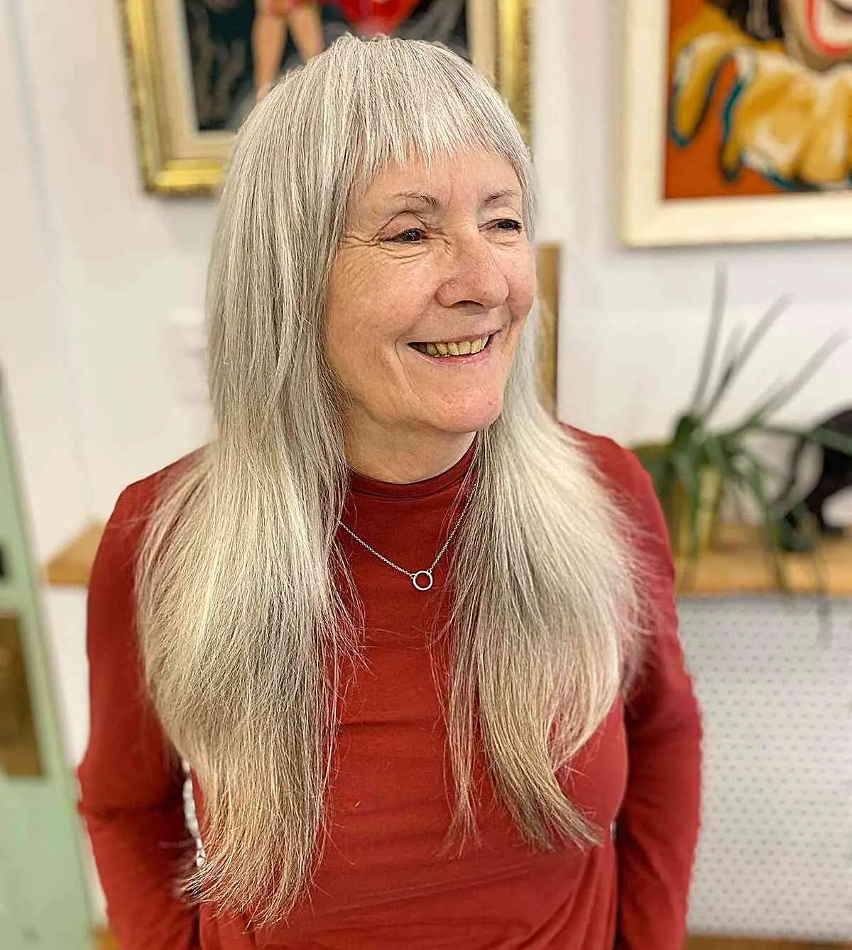 chest straight gray layers with blunt fringe shown as a layered hairstyles for women over 60 idea