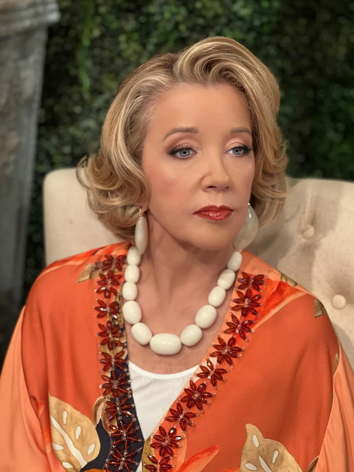 shoulder wavy golden layers shown as a layered hairstyles for women over 60 idea