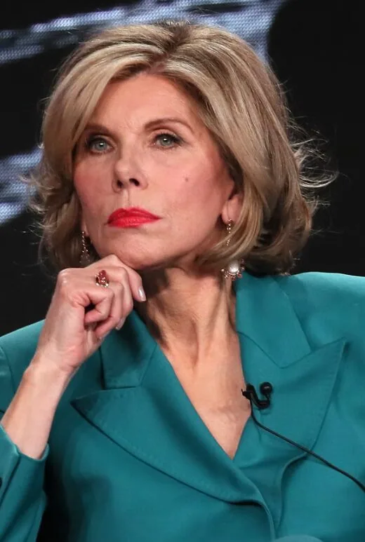 neck wavy brunette bob with side swept fringe shown as a layered hairstyles for women over 60 idea