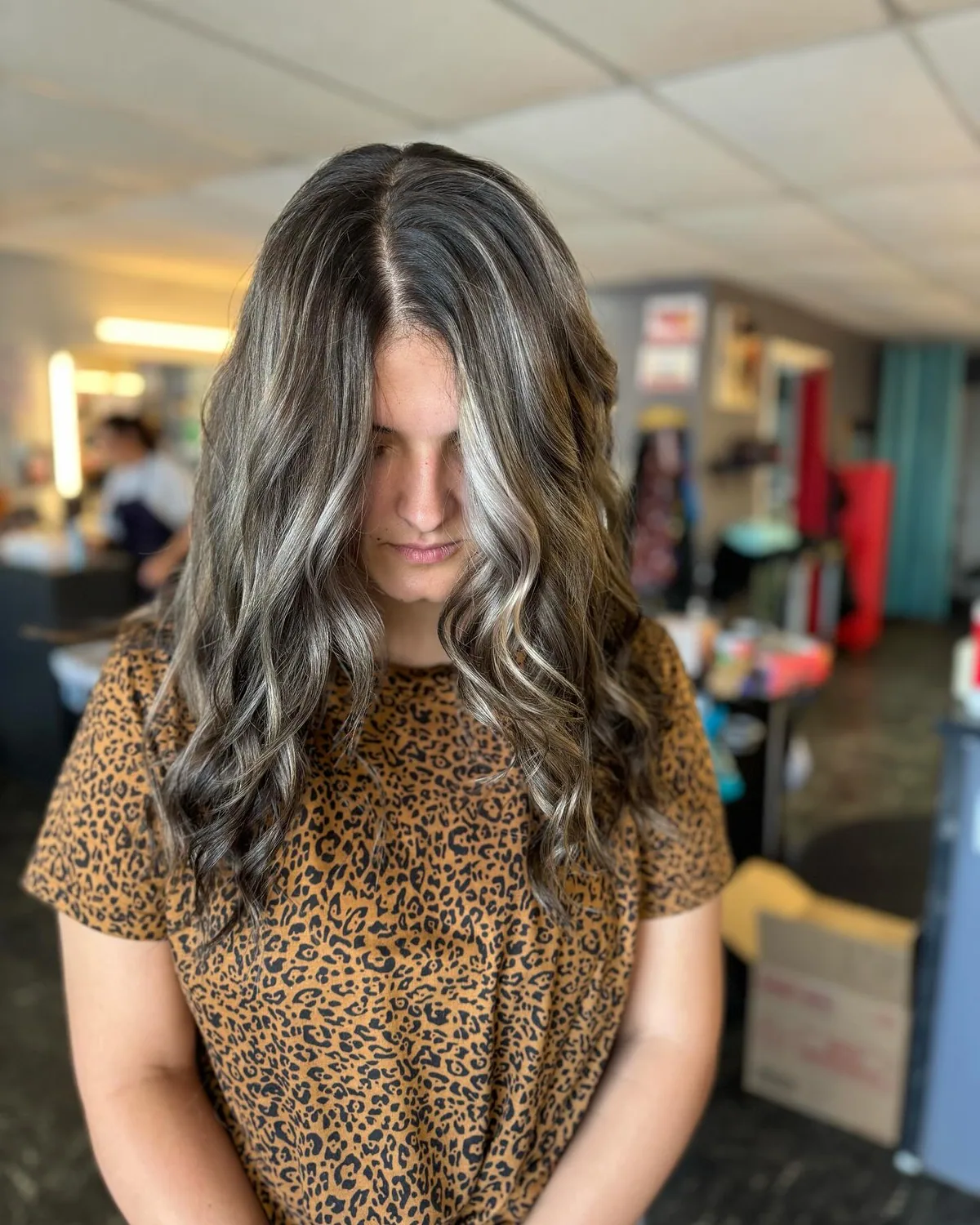 chest wavy silver layers shown as a layered hairstyles for women over 60 idea, featuring medium layering