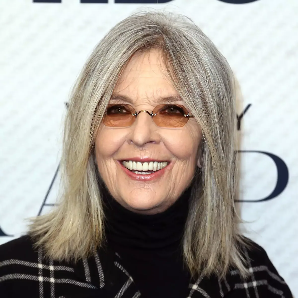 shoulder straight gray layers with curtain fringe shown as a layered hairstyles for women over 60 idea