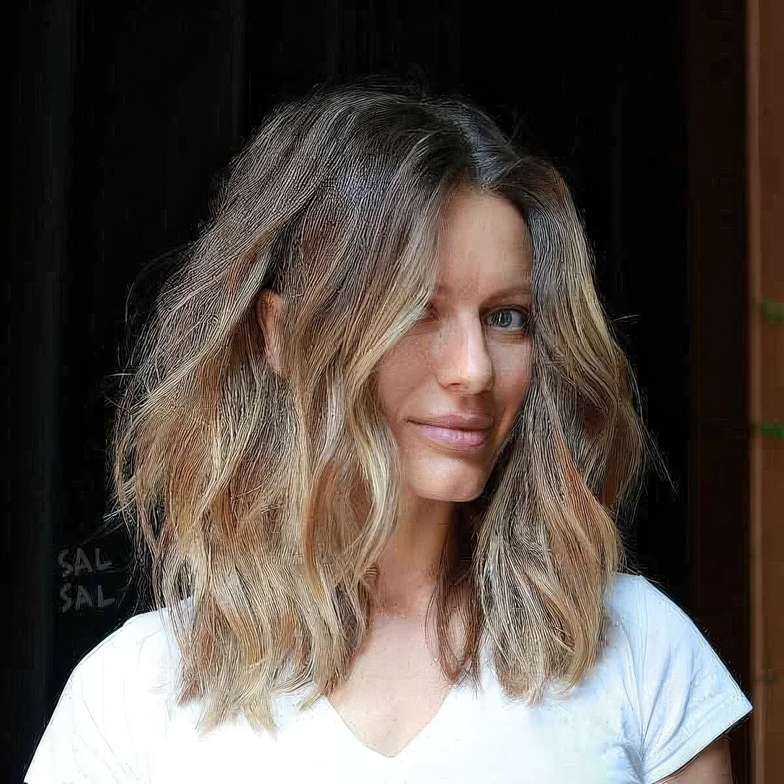 Photo showing hairstyle with blonde balyage, with the hairstyle clearly visible.