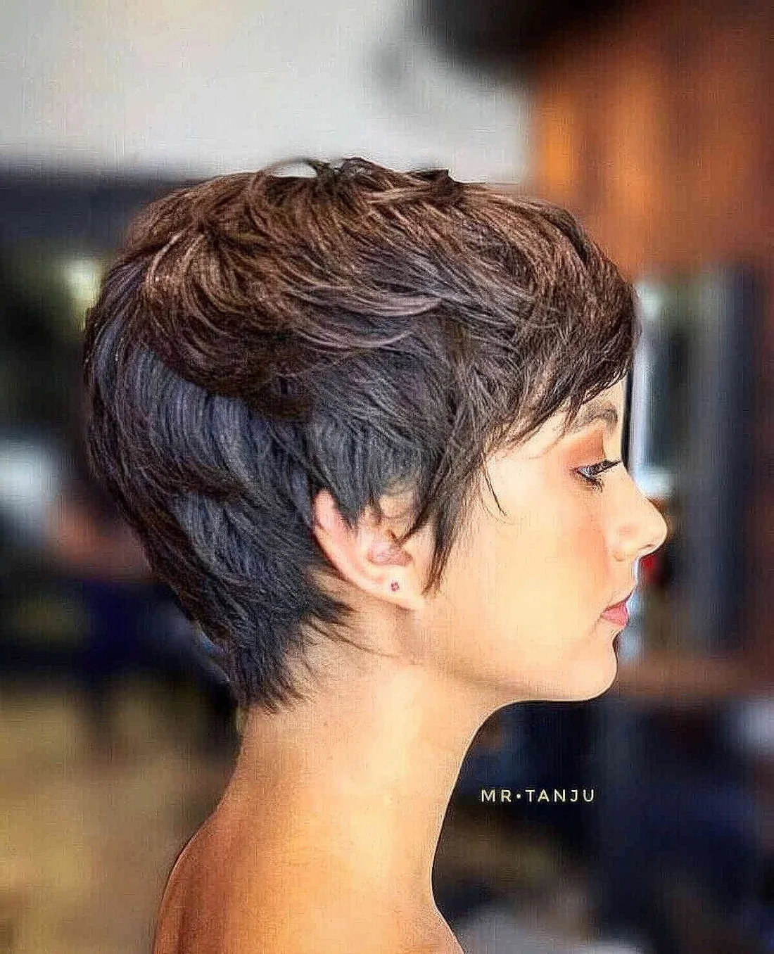 Brunette layered pixie on thin hair, with texture paste to create a volume and make a lovely finish.