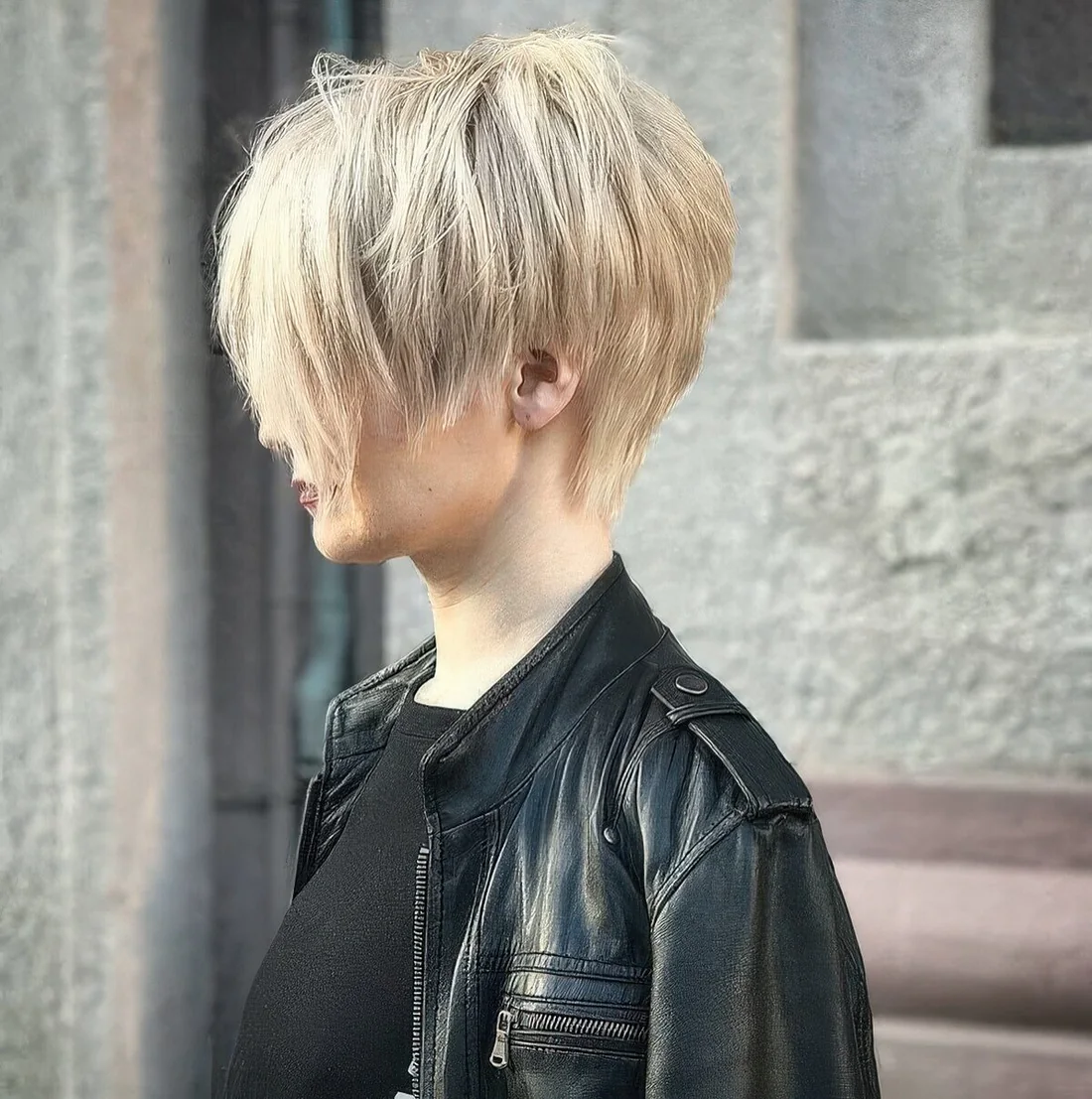 Layered and shaggy pixie haircut for daring girls done in a soft and warm blonde shade.