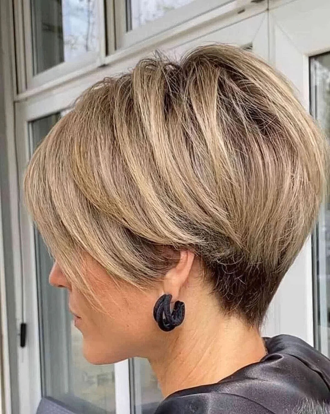 Long pixie with layers, volume and highlights features textured layers, hair.