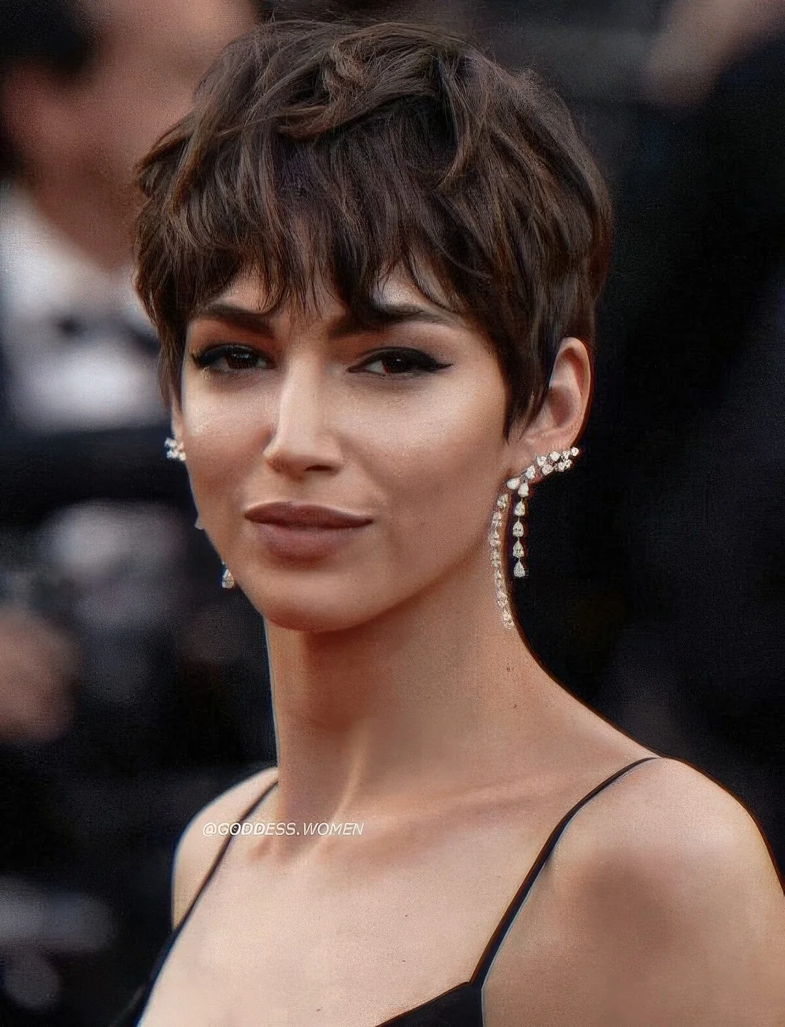 Brown layered pixie with long fringe, sides and a longer top.