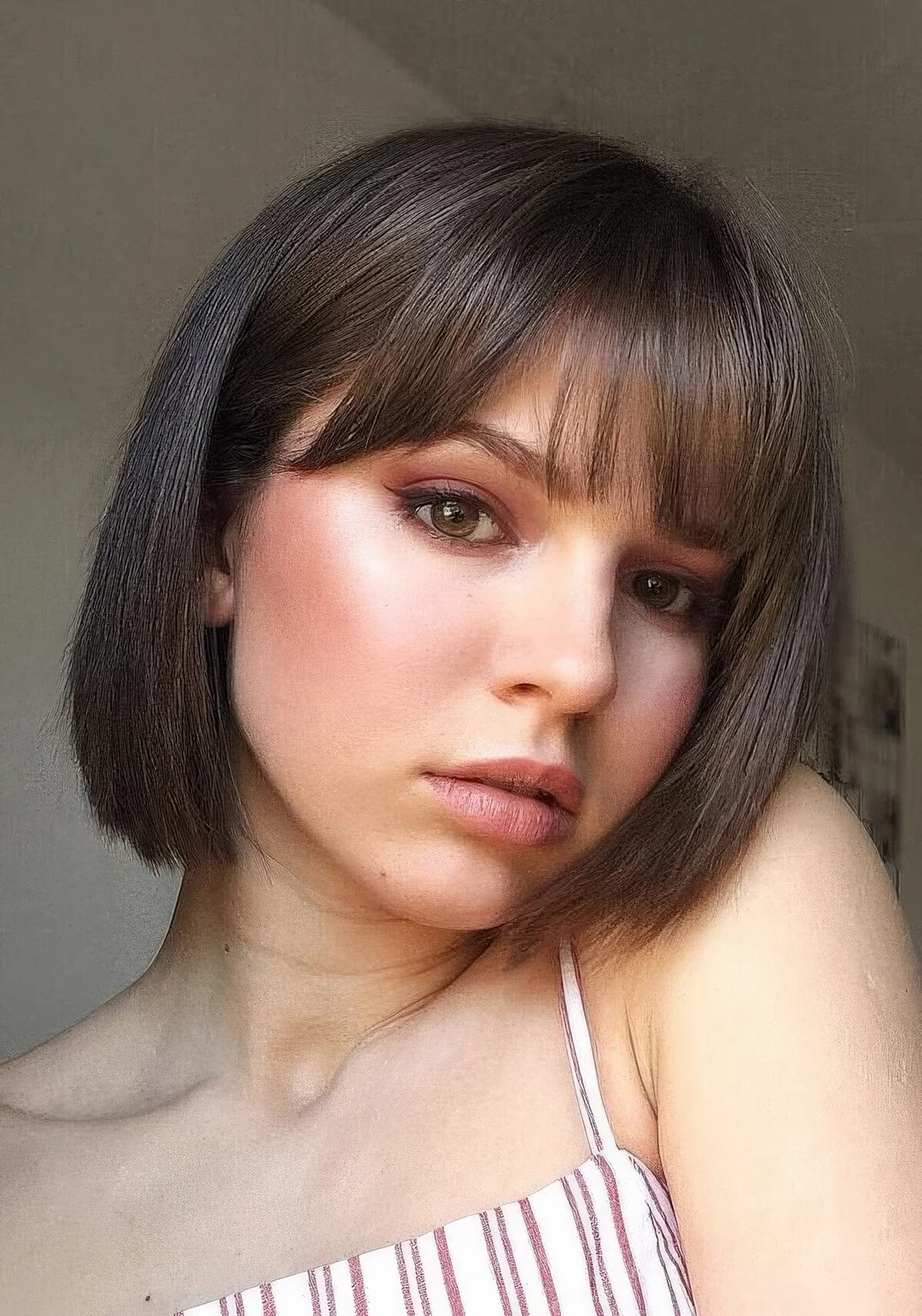 Brunette bob with curtain and classic bangs.