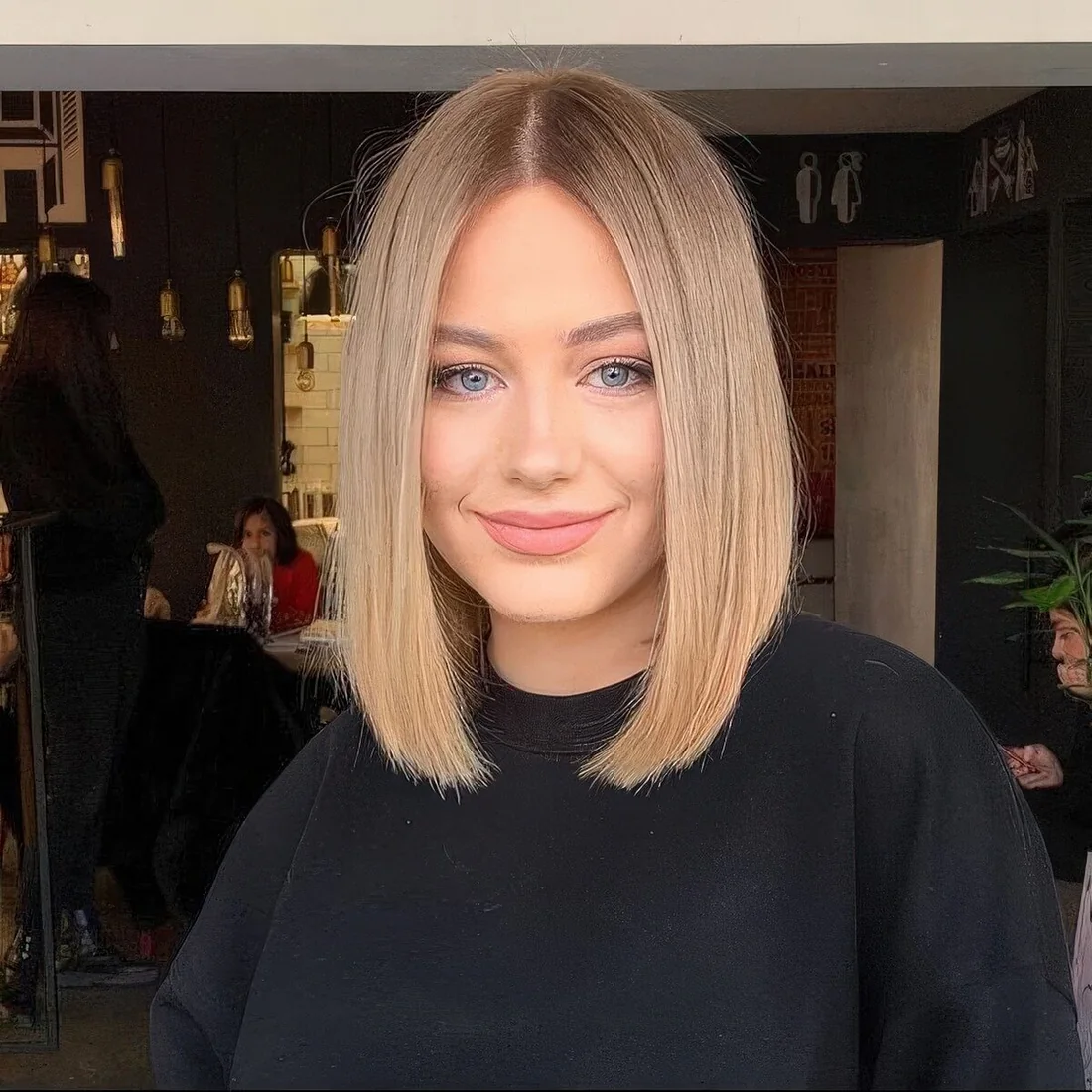 Bronde liquid long bob with center part.