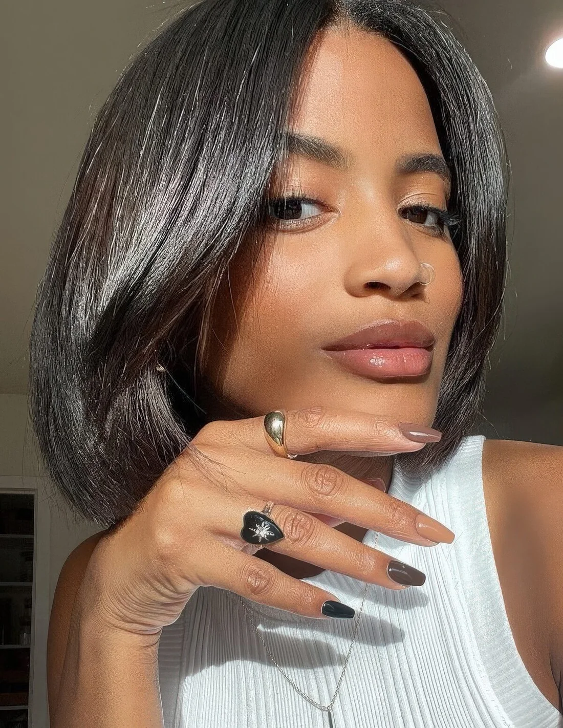 Fab and shiny black liquid bob withcurtain bangs.