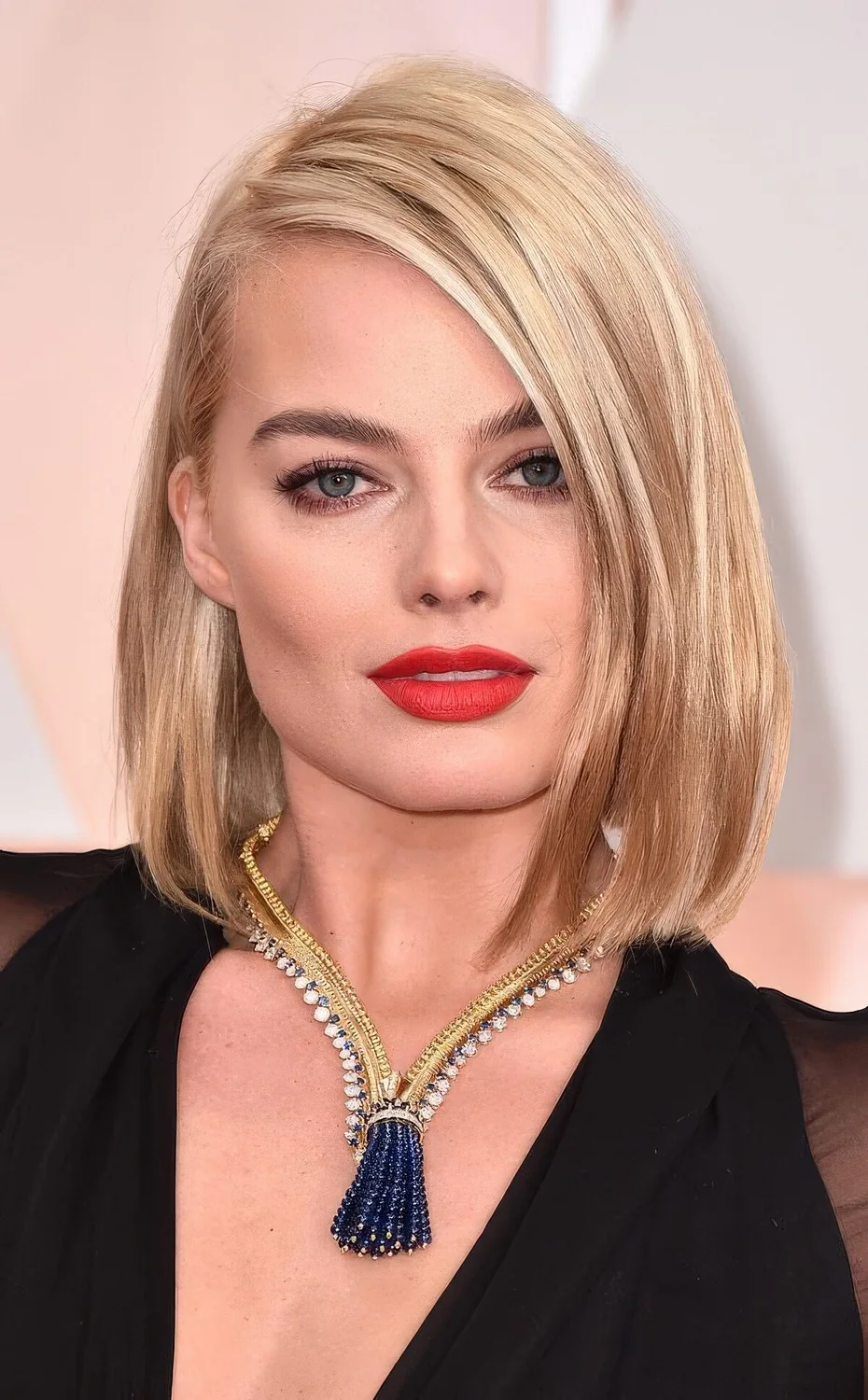 Jaw dropping creamy blonde liquid bob with side part and a bit of volume.