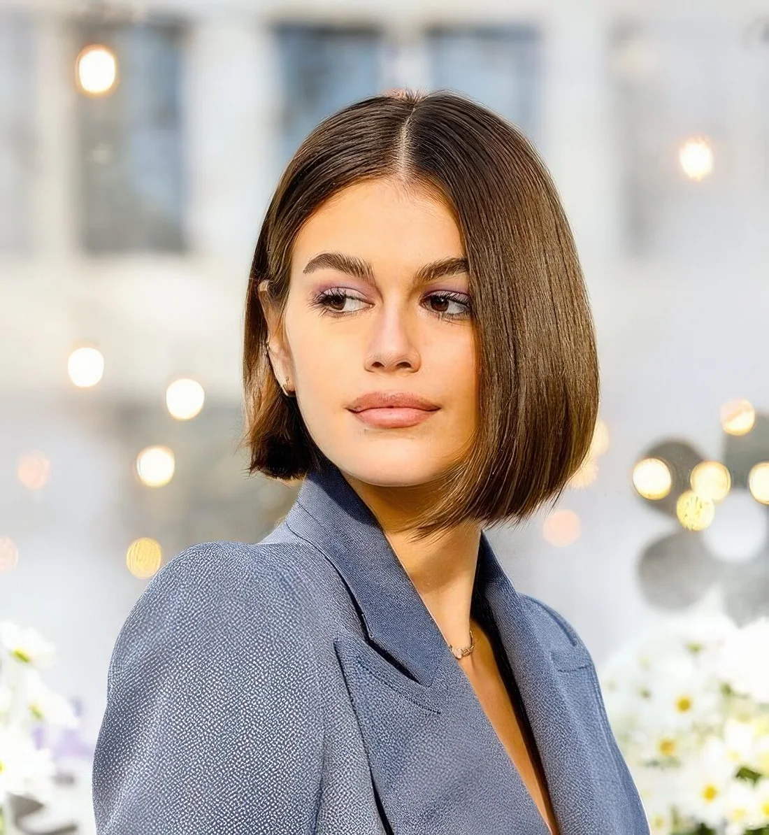 Liquid brown bob with center part chosen by Kaia Gerber.