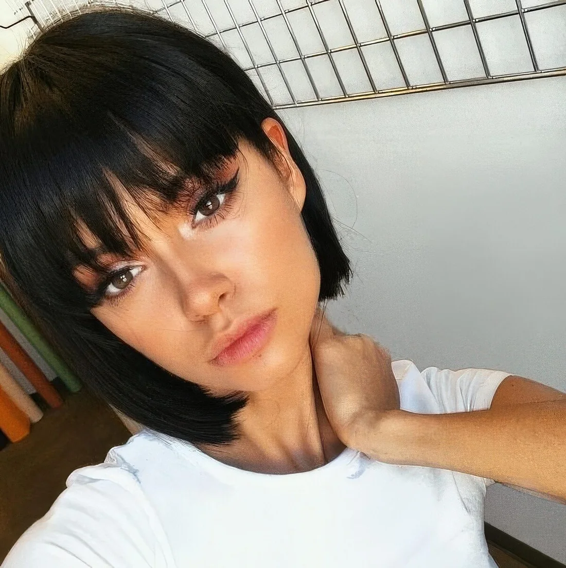 Black liquid boy bob with bangs for a super cute, doll like look.