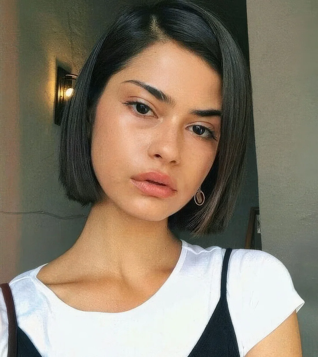 Sleek liquid boy bob with side part.