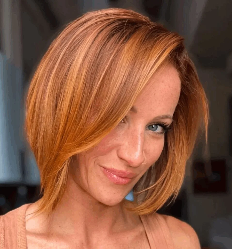 shoulder straight copper lob with side swept fringe shown as a lob haircuts for thin hair idea