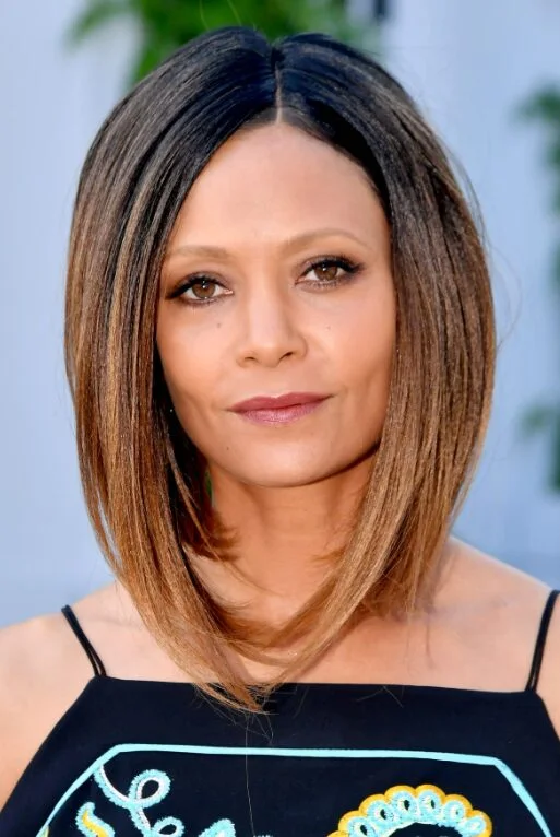shoulder wavy chestnut lob shown as a lob haircuts for thin hair idea, featuring wavy texture, shown in caramel sleek lob