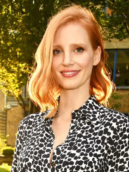 shoulder wavy chestnut lob shown as a lob haircuts for thin hair idea, featuring chestnut color, shown in copper wavy lob with side part