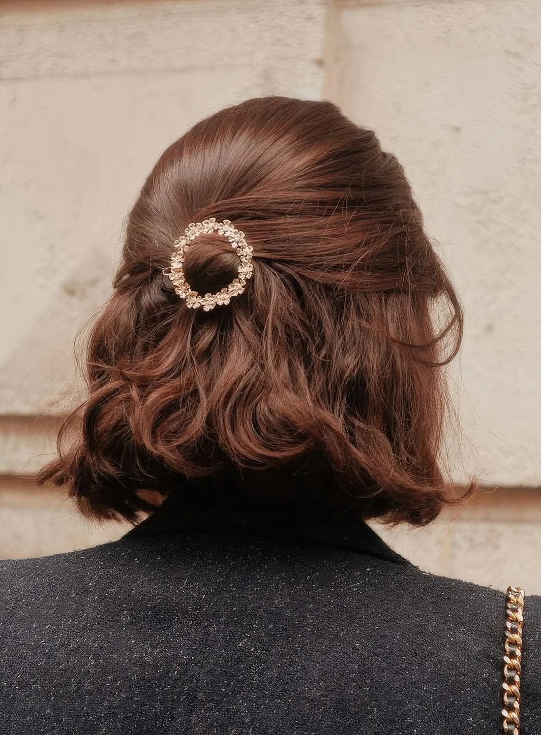 Chic and pretty half updo with a sleek top and waves down plus a beautiful embellished hair piece.