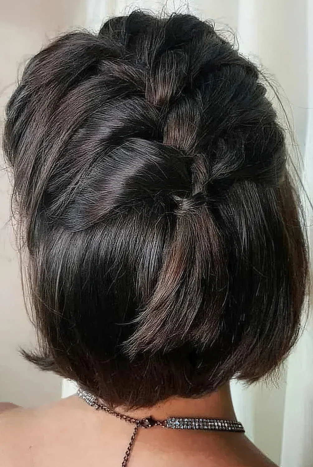 Photo showing half updo with a braid on top, with the hairstyle clearly visible.
