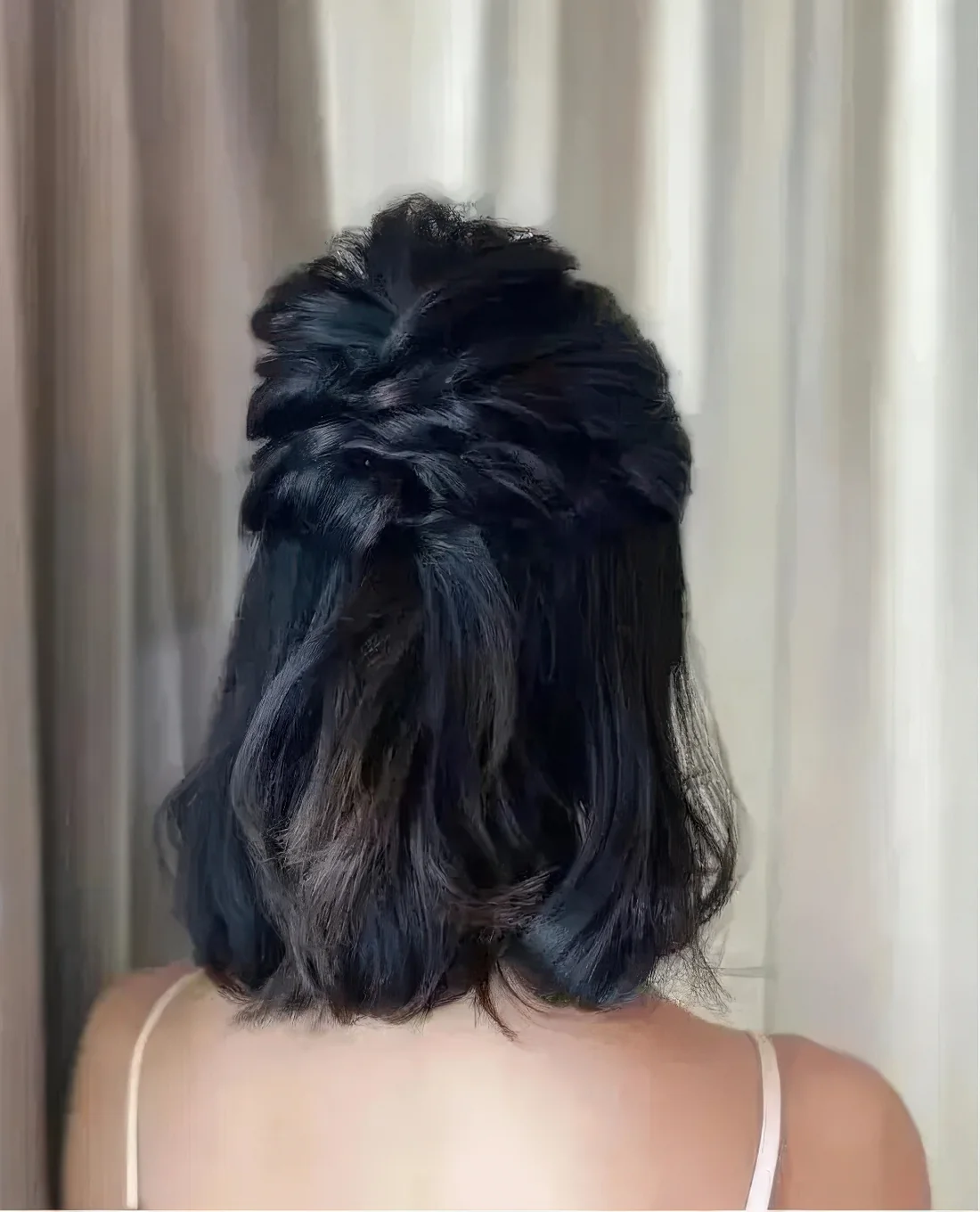 Half updo with twisted halos and a bump on top and some waves down.