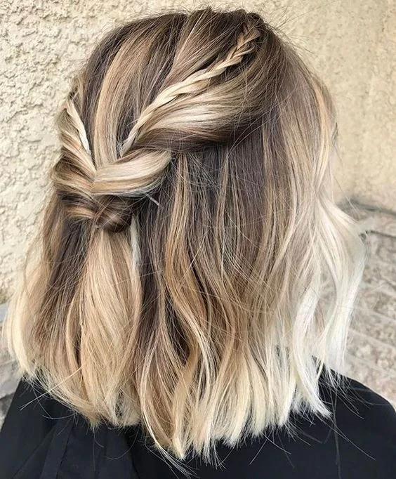 Two tiny braids added to one large twisted braid to make the hairstyle cooler.
