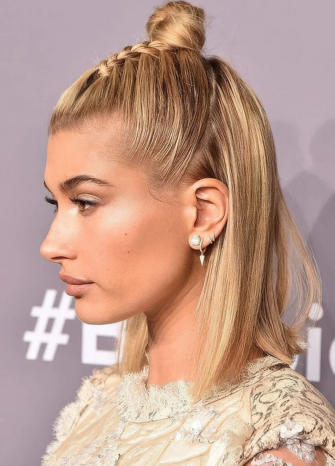 Half updo with a braid and a top knot and some hair down are a lovely combo for a party.