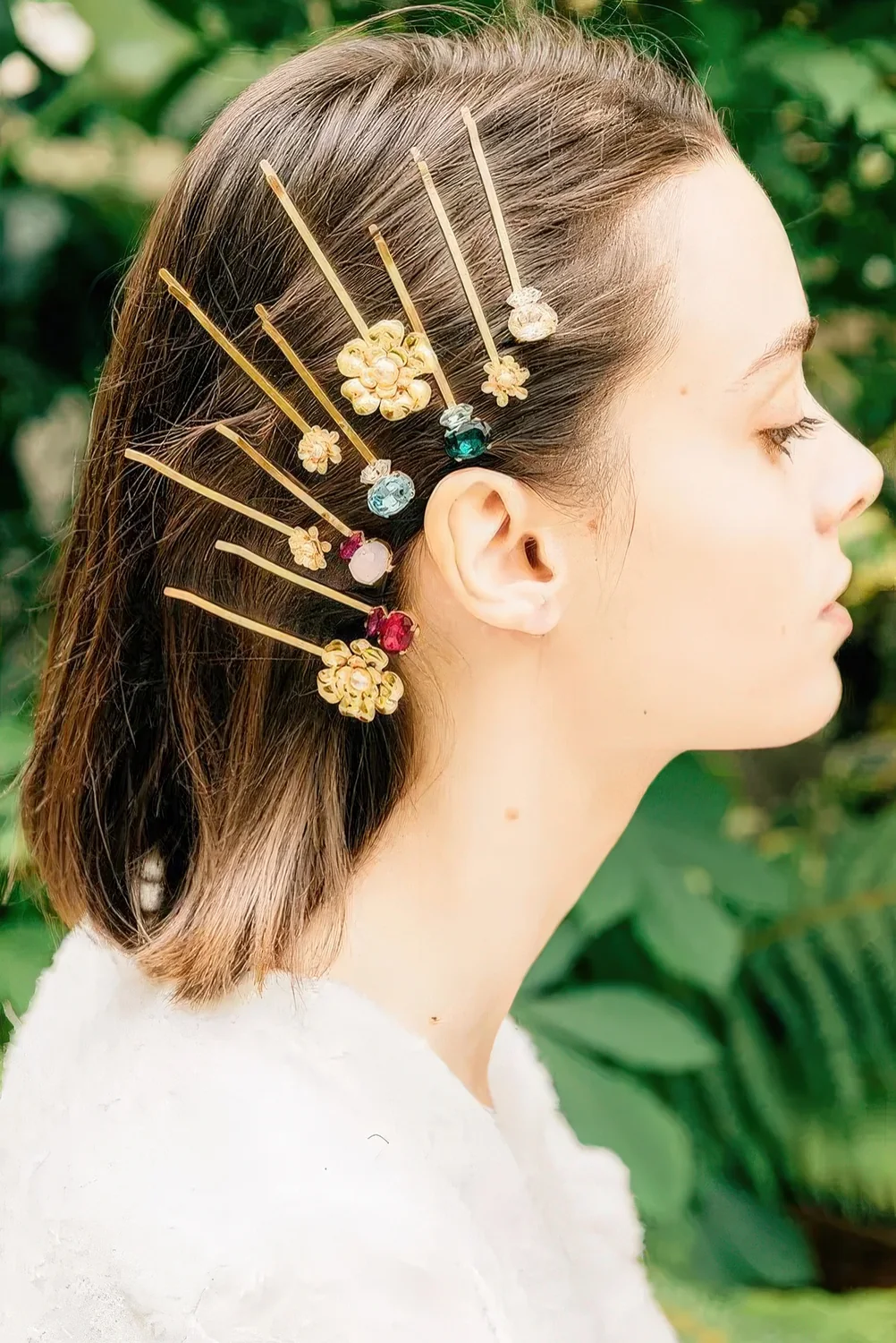Multiple floral and gemstone hairpins.
