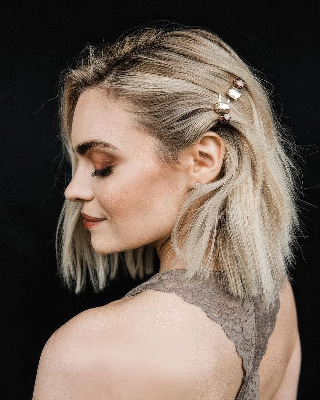Textural and messy long bob accented with rhinestone hair pins.