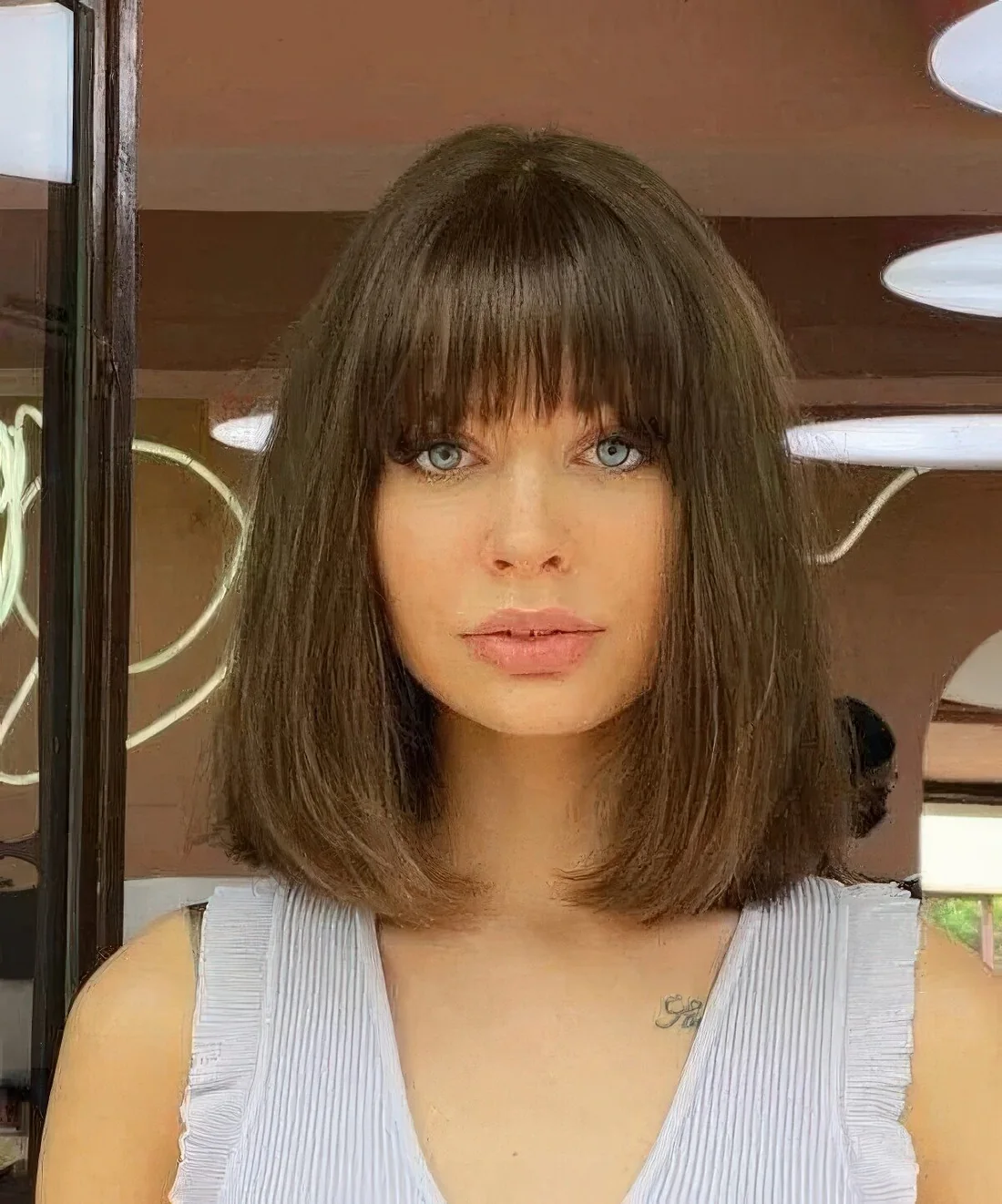 Brown long bob with a classic fringe and a lot of volume.