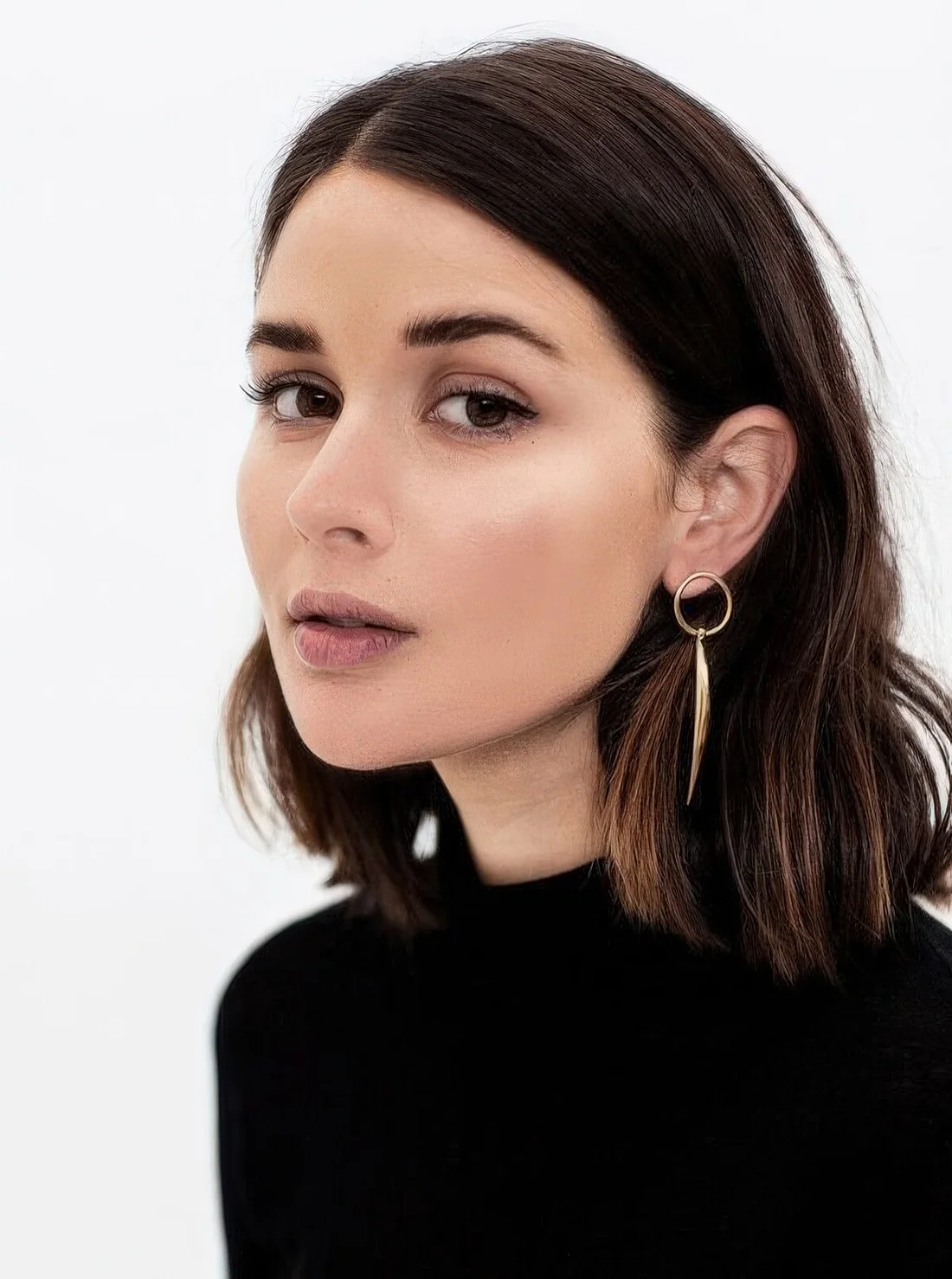 Dark brunette wavy long bob with side part and caramel touches plus waves.