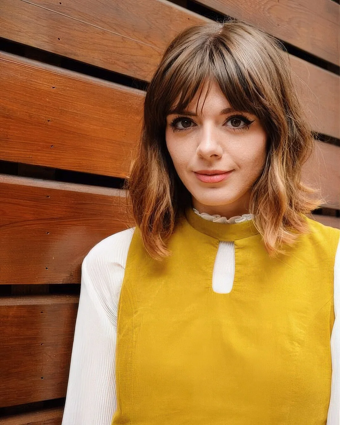 Brown long bob with bottleneck bangs and messy waves.