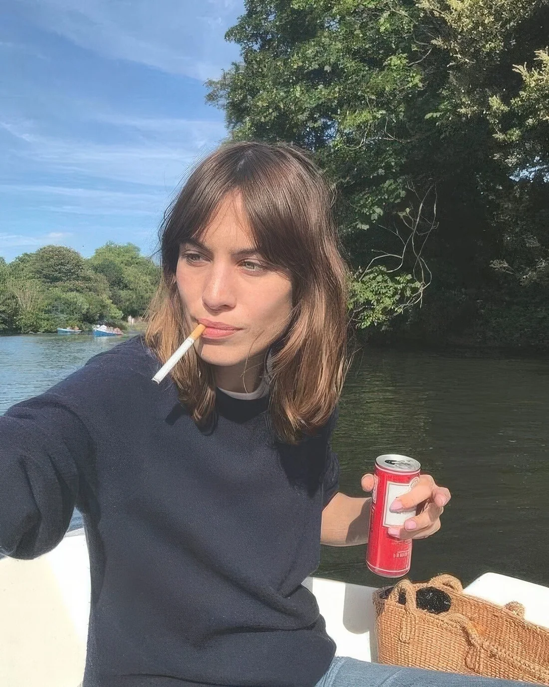 Brunette long bob with caramel touches and bottleneck bangs.