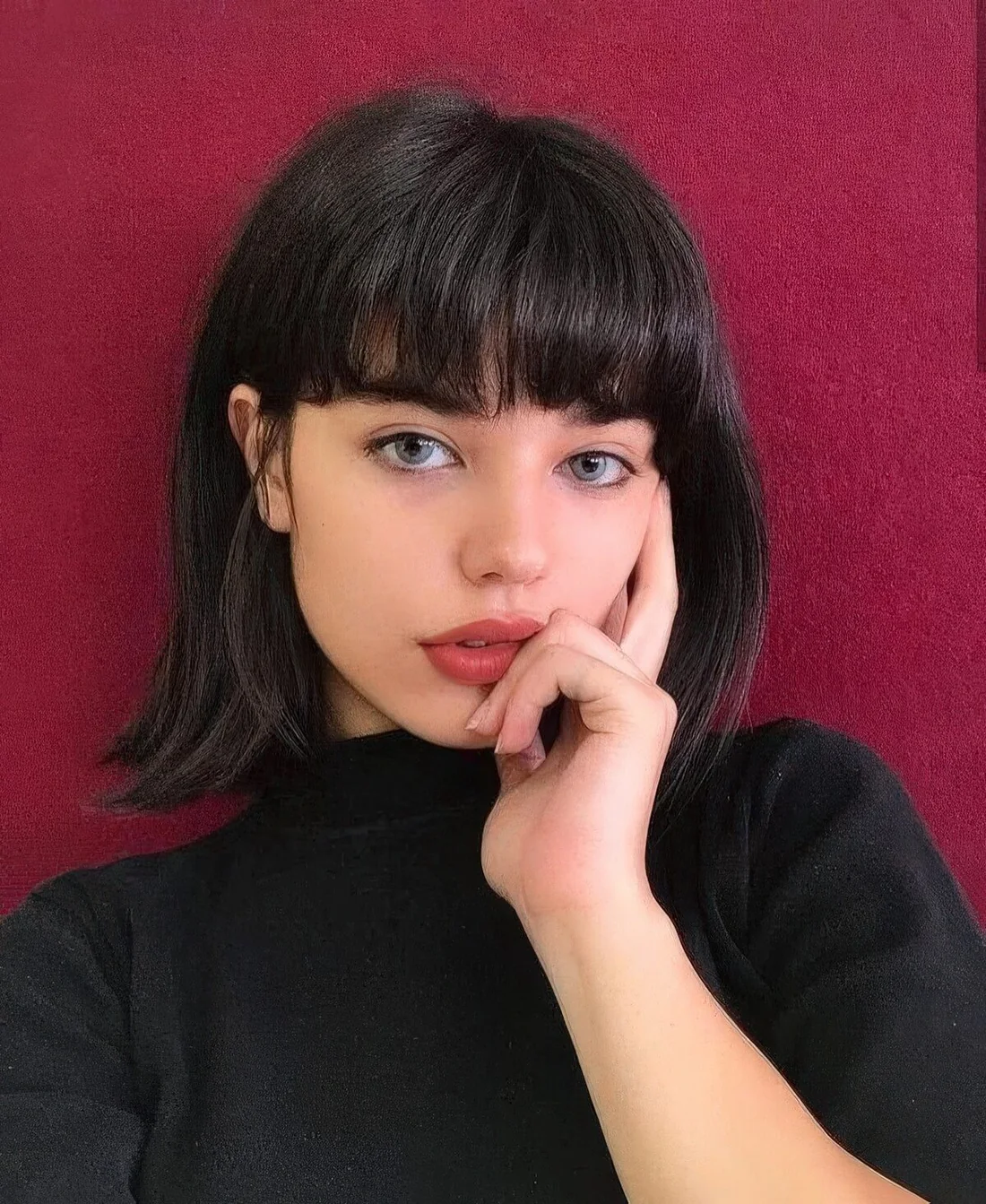 Photo showing black long bob, with the hairstyle clearly visible.