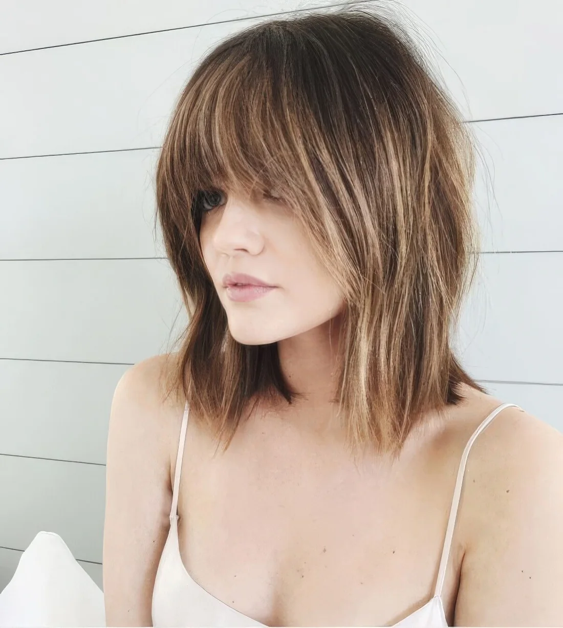 Photo showing brown bob blonde highlights, with the hairstyle clearly visible.