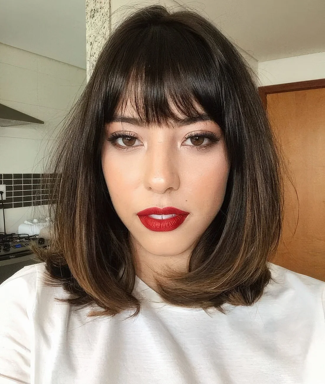 Photo showing brown bob, highlights, with the hairstyle clearly visible.