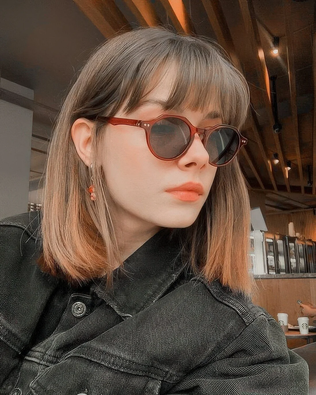 Photo showing brown long bob, with the hairstyle clearly visible.